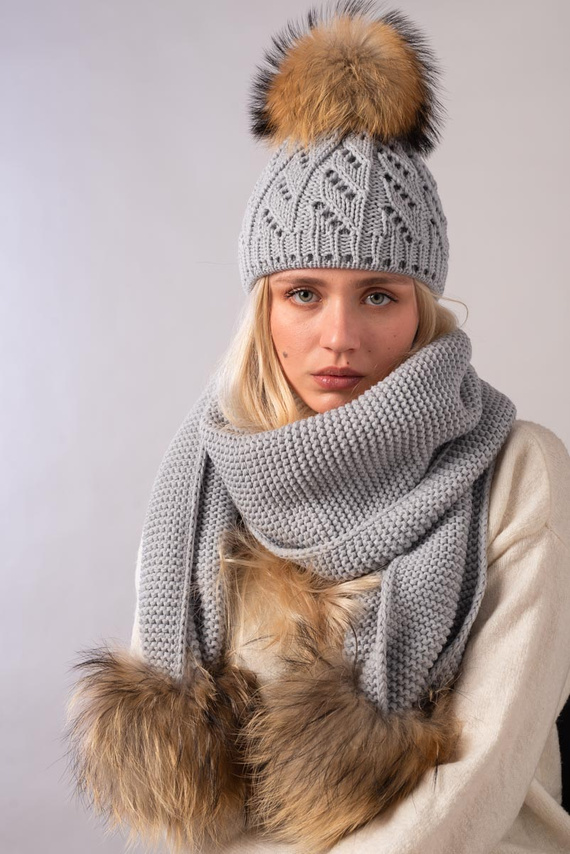 Woolen set with pompoms from a natural Finland raccoon fur.